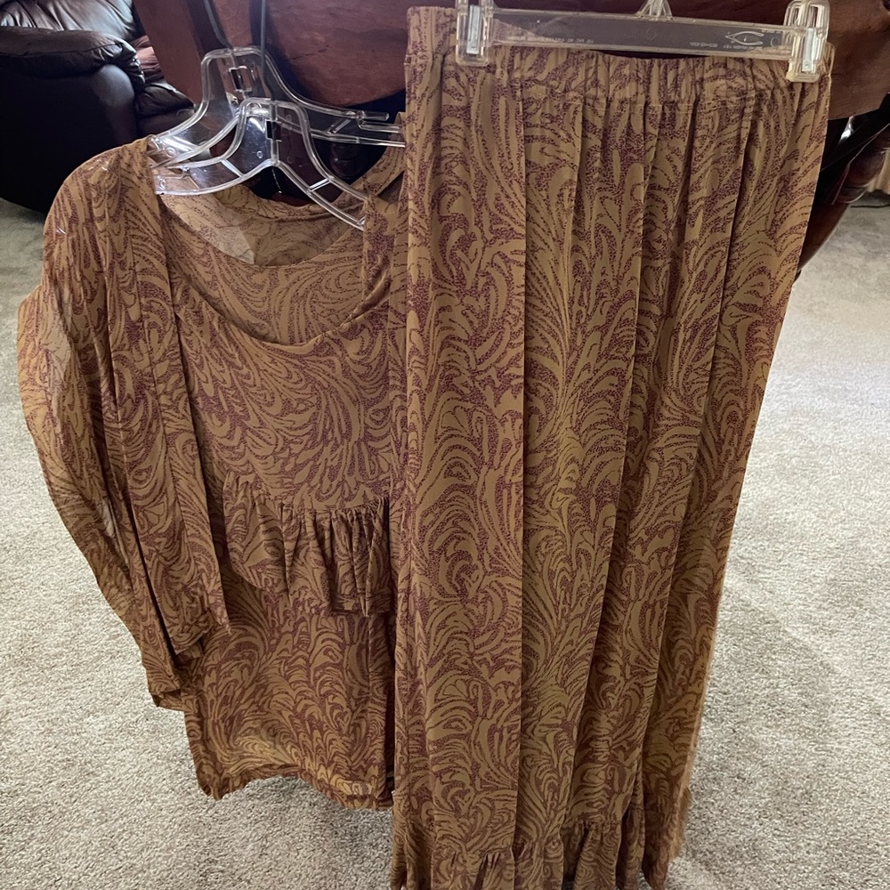 Sheer three-piece beige and burgundy outfit